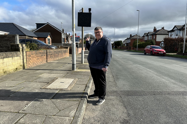Tom at the speed sign on Bury New Road.