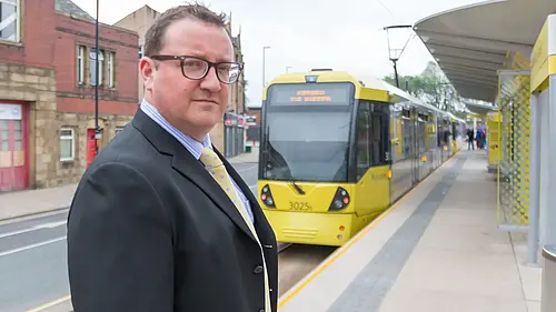 Andy Kelly with a tram