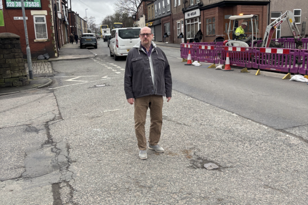 Iain Donaldson pictured at the latest utility roadworks on Manchester Road at Heywood Station Bridge.
