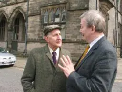 Councillor Alan Taylor discusses Lib Dem policies with a local resident.